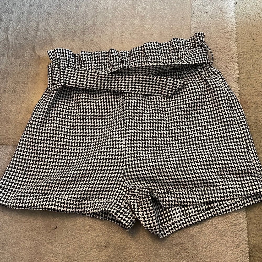 black and white shorts, too big on me, comes with a belt, very good material